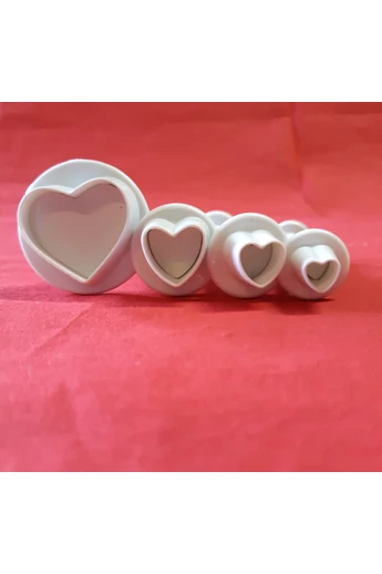 Kiszúró : műanyag, rugós szív,  4 db./csg.
